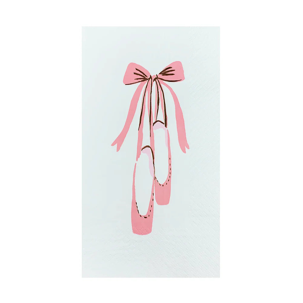 Close-up of a white guest napkin featuring an illustrated pink ballet slipper tied with a ribbon bow.