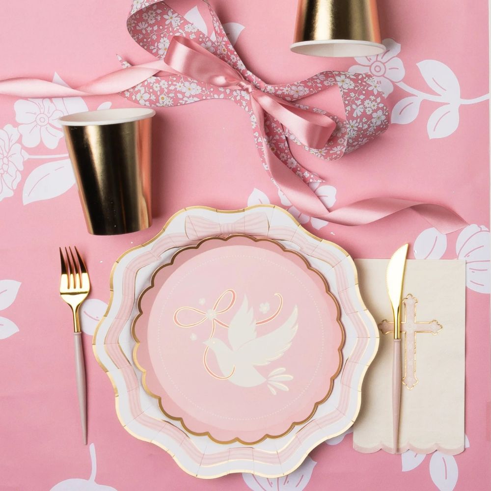 Pink bow dinner plate with gold utensils and floral details for baptism
