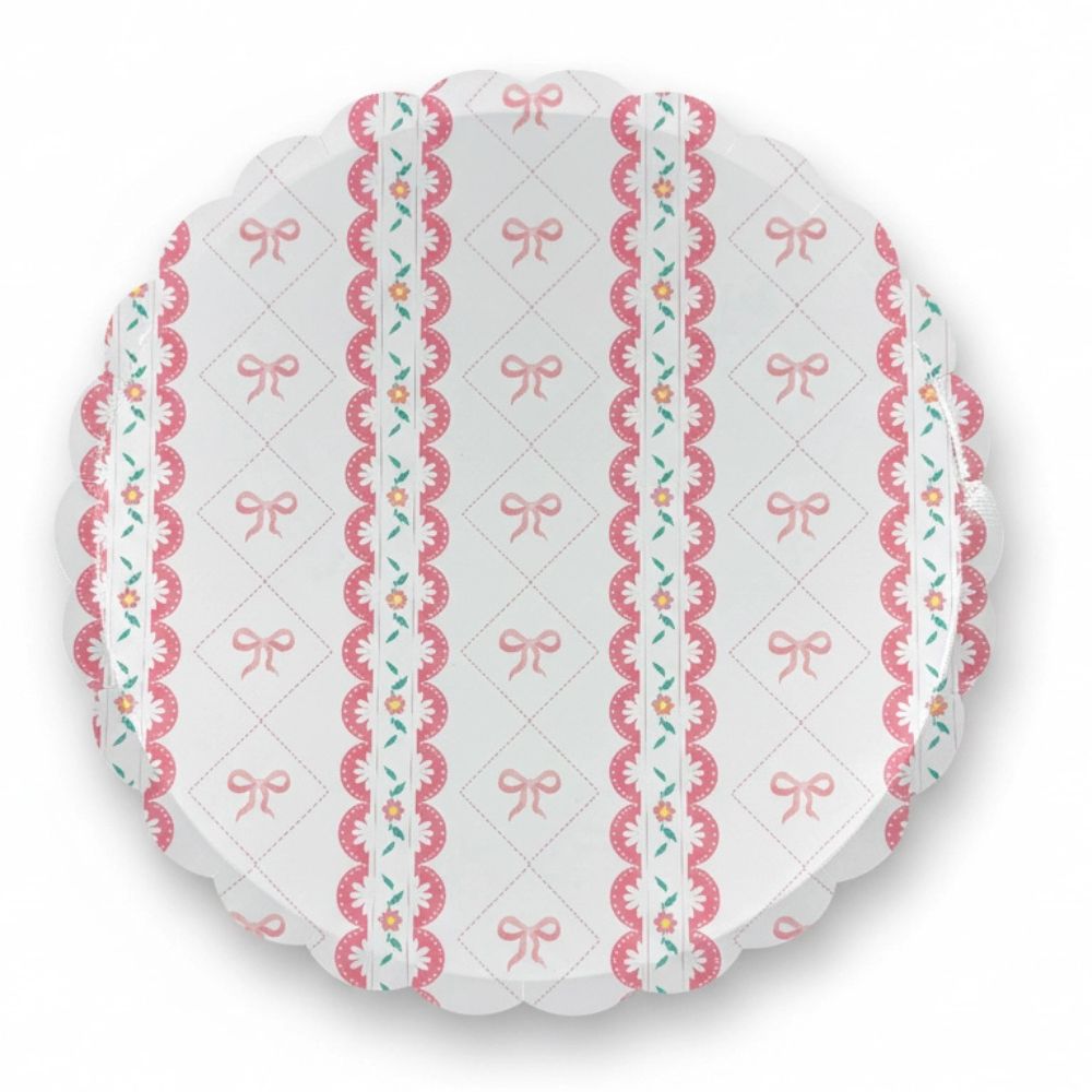 Single 10-inch paper plate with pink bow lattice and scalloped edge