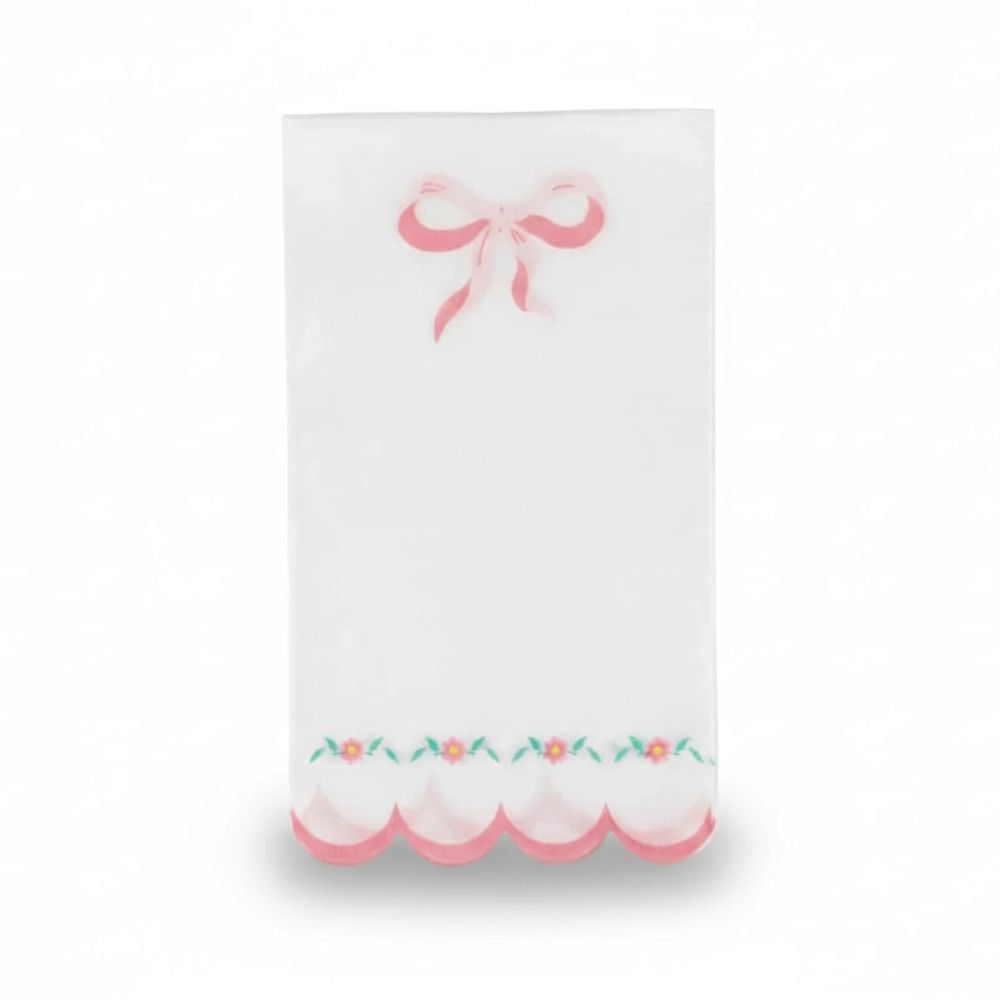Single white luncheon napkin with a pink bow and scalloped floral edge