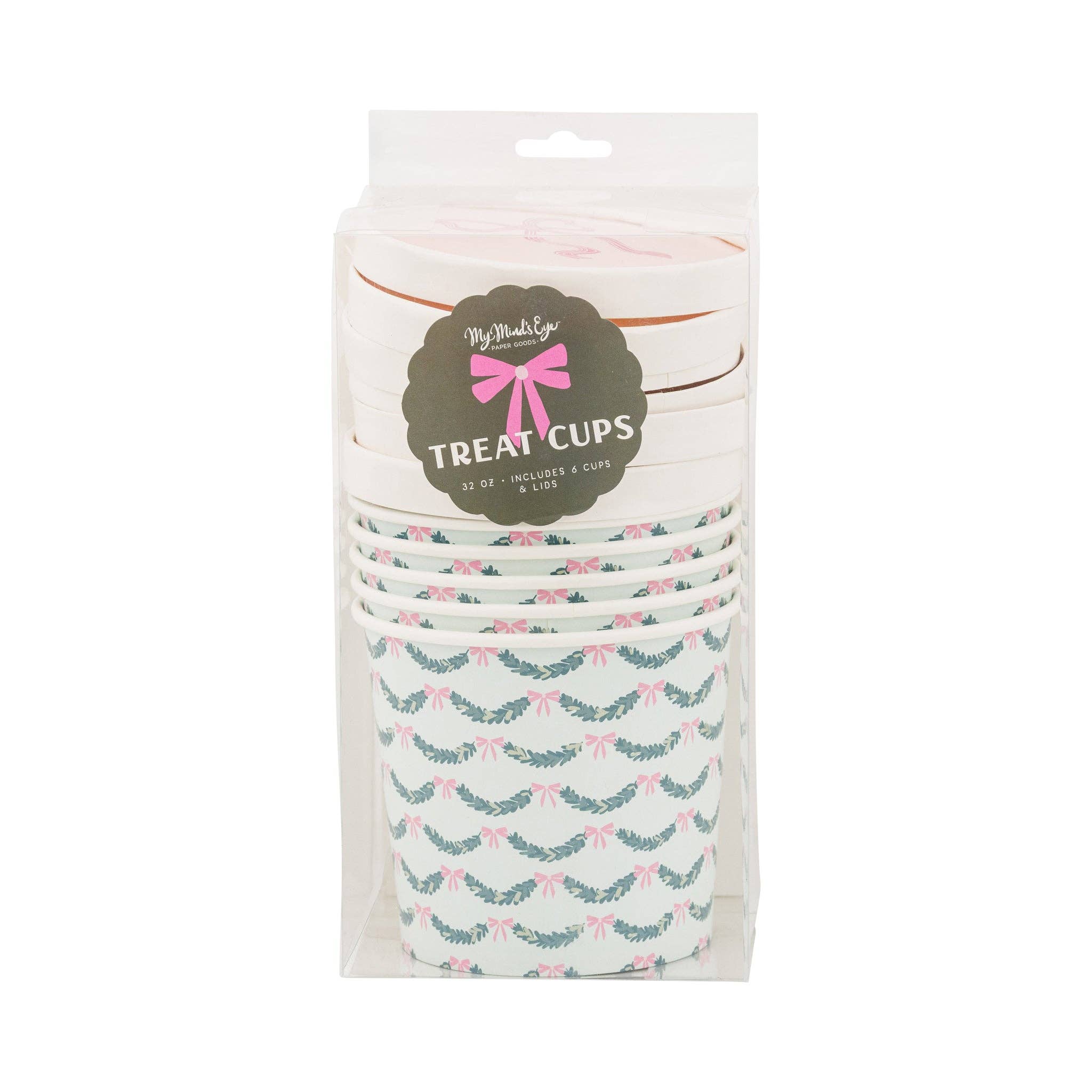 Packaged set of pink bow treat cups with lids in clear packaging.