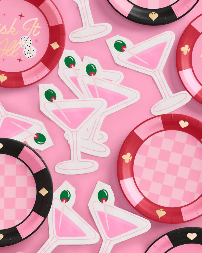 Pink martini napkins styled with red and pink checkered casino plates and "Risk It All" plate flatlay
