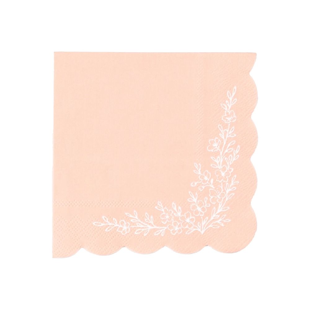 Pink scalloped floral cocktail napkin with white botanical design