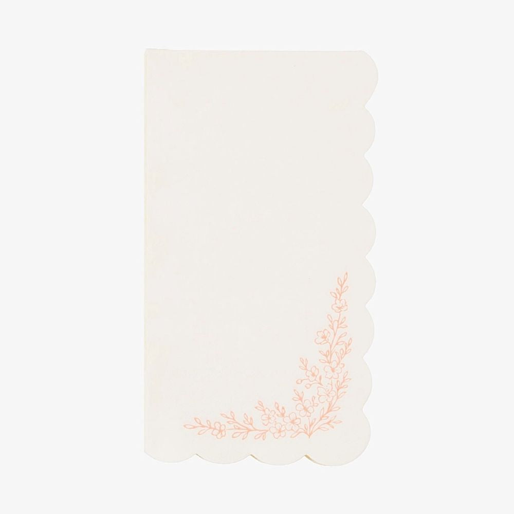Single ivory guest towel with a scalloped edge and pink floral corner spray