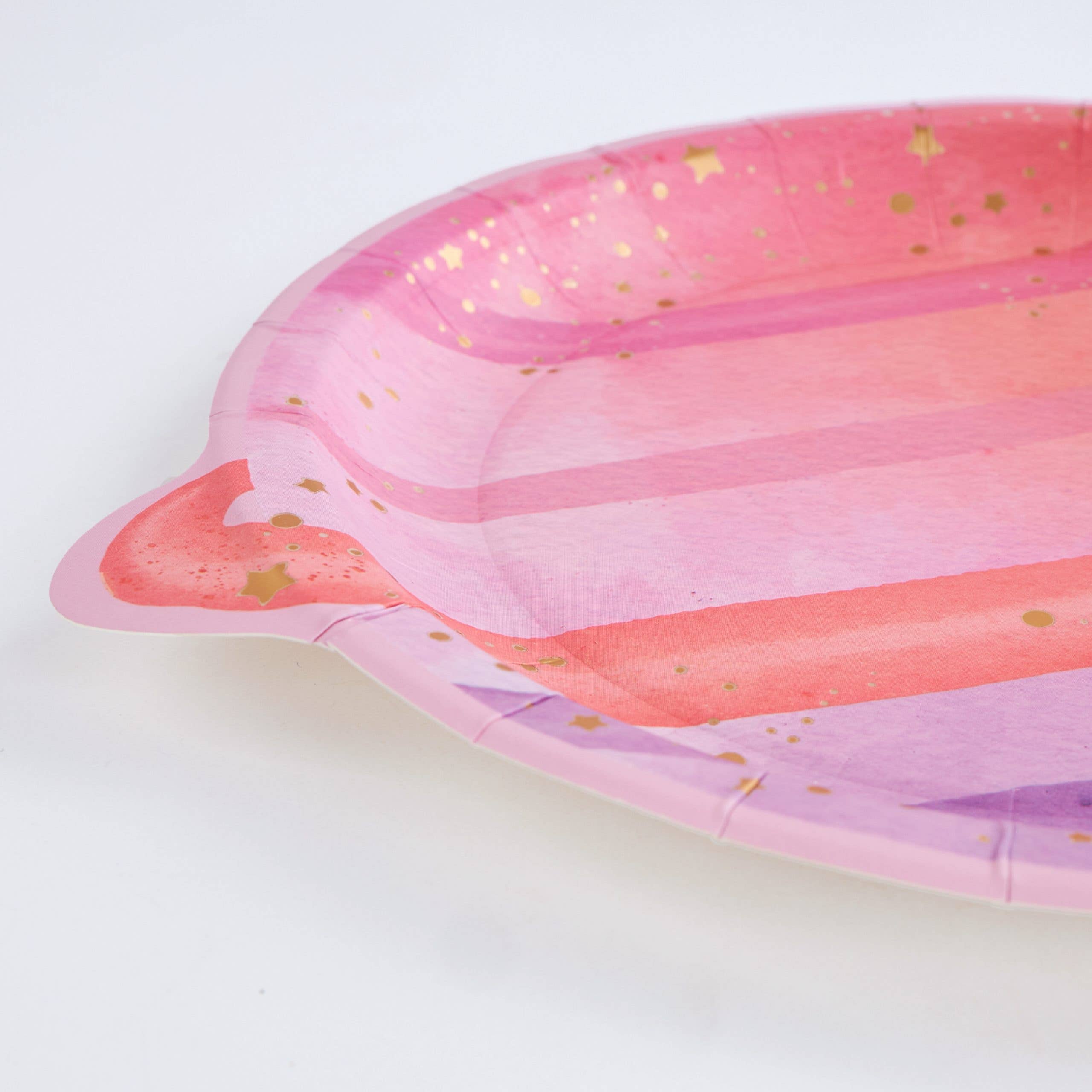 close up of planet plate showing curved edge and gold foil detail