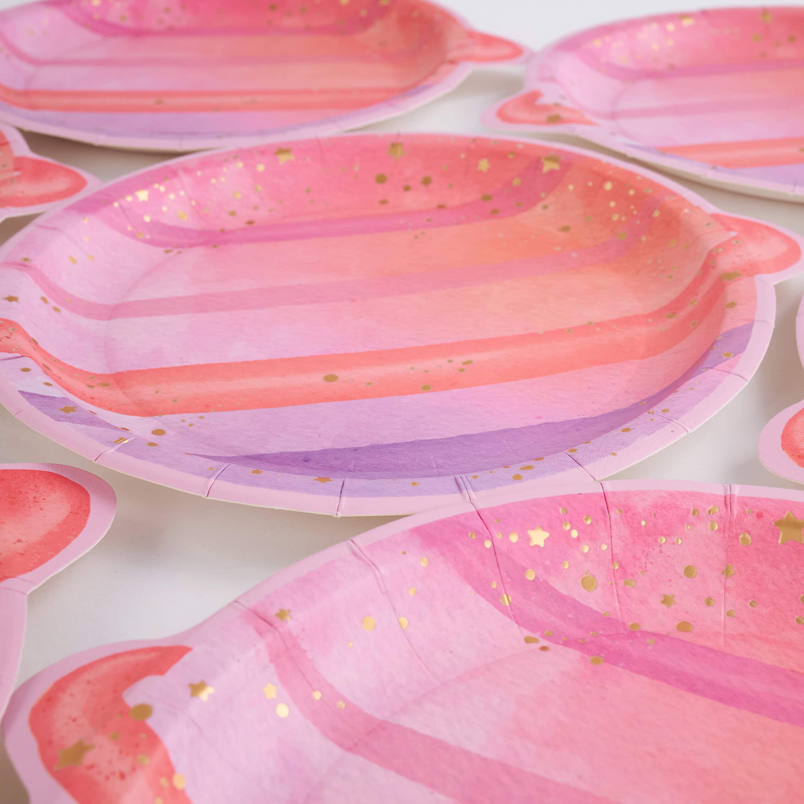 assortment of planet shaped plates for space party table