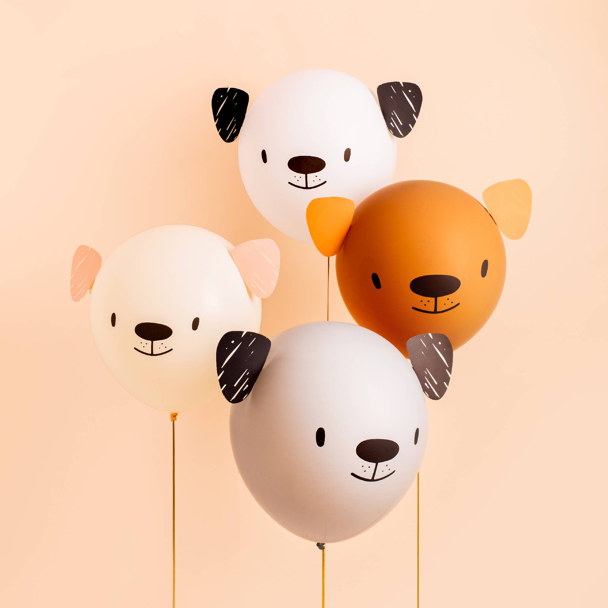 Assembled puppy balloons in neutral colors styled for a dog birthday party