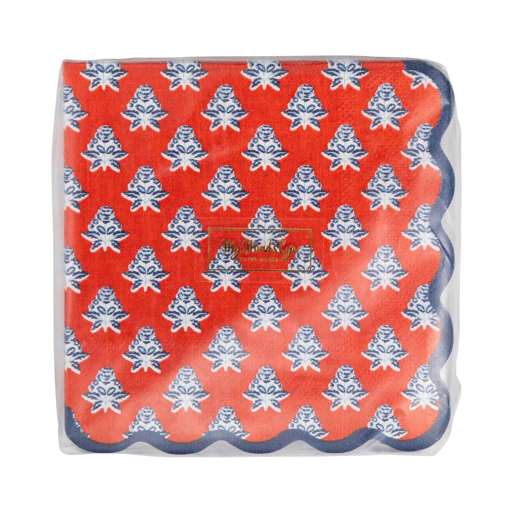 Red block-print floral paper cocktail napkins in packaging showing full indigo blue floral pattern on red base with navy scalloped edge