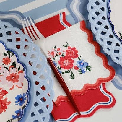 A floral 4th of July Paper Napkin layered over a solid red Patriotic Guest Towel.