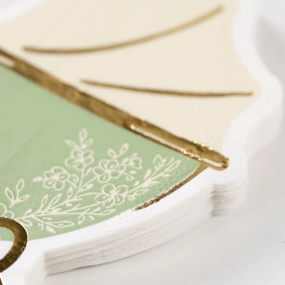close up of floral detail on sage napkin.