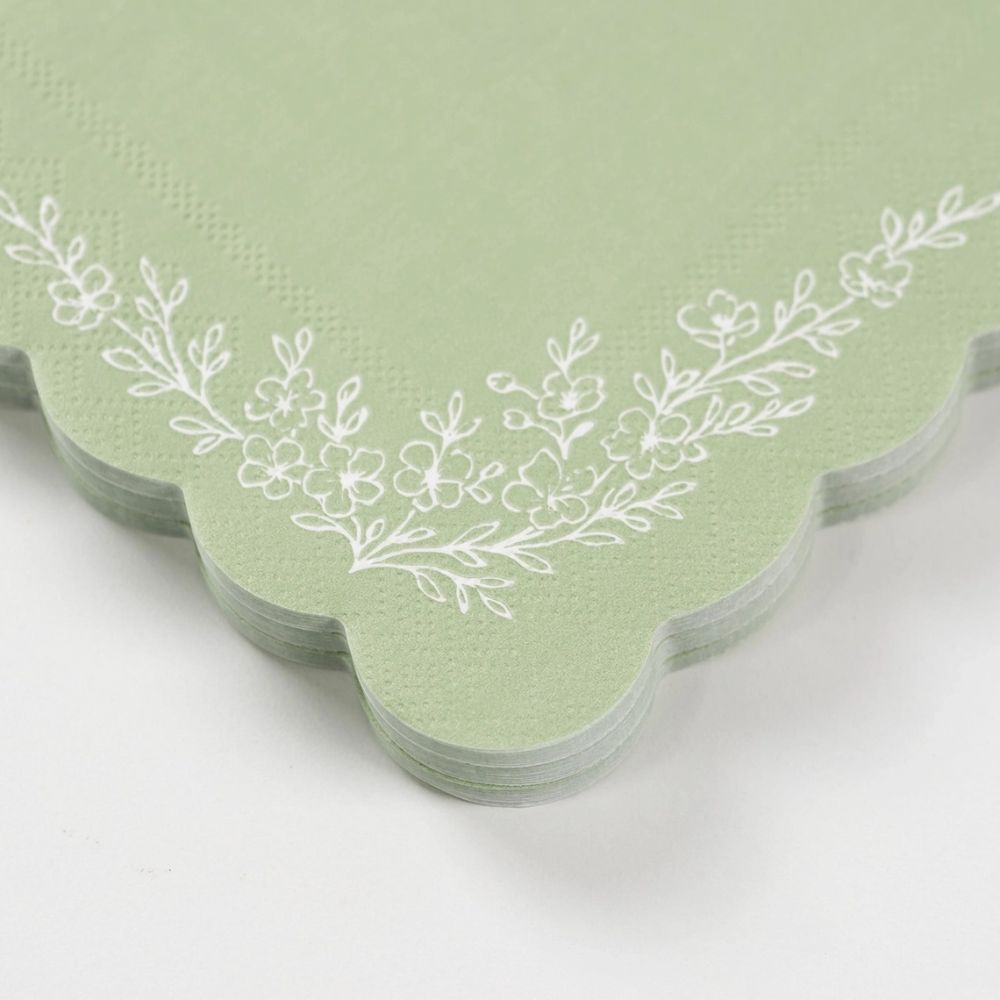 close up of floral illustration on sage cocktail napkin.