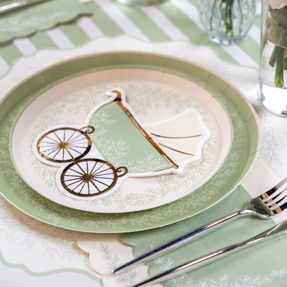 sage floral napkins styled with plates and table setting for baby shower