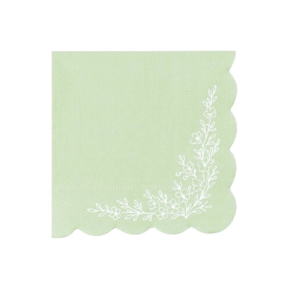 sage green cocktail napkin with scalloped edge and floral corner design.