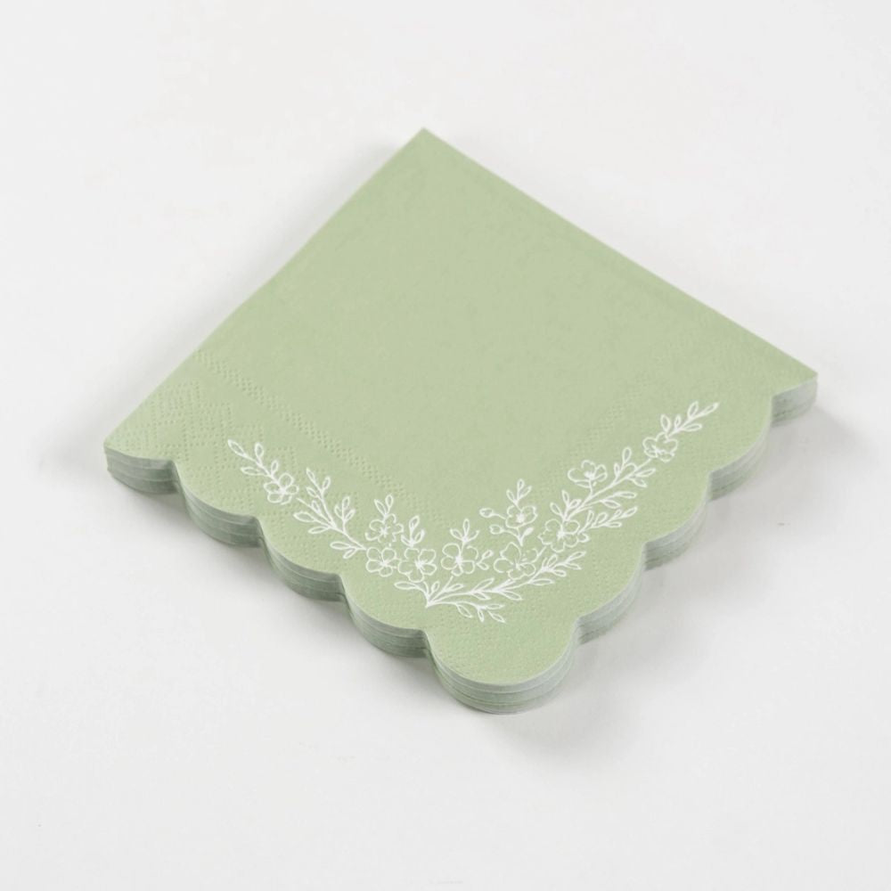 sage napkins stacked showing layered scalloped edges.
