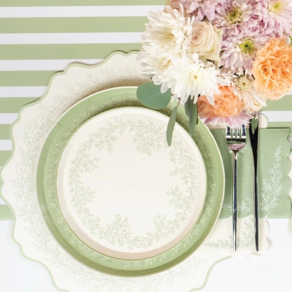 sage floral placemat styled with layered plates and table setting.
