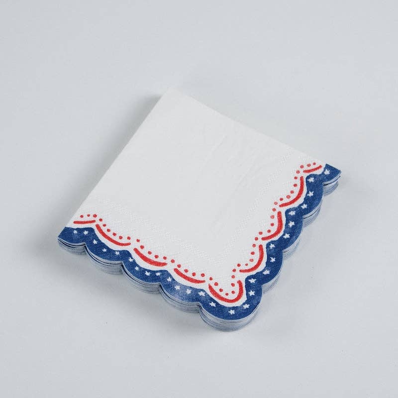A stack of Red White and Blue Napkins showing the die-cut wavy edge for a Boutique-Ready look.