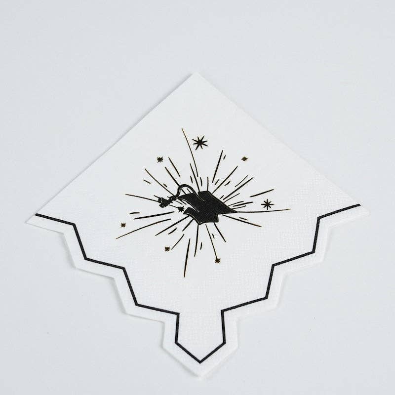An angled view of a scalloped grad cap napkin showing the unique commencement silhouette.