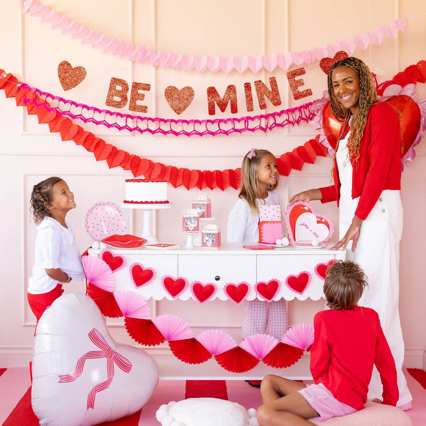 Valentine’s Day table setup featuring scalloped heart shaped plates