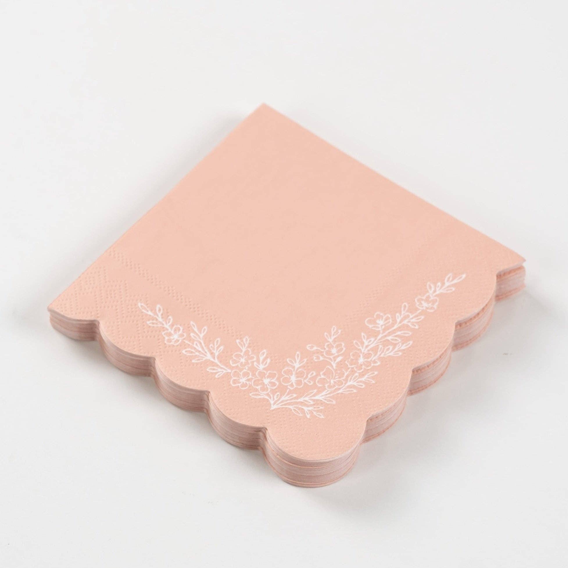 Stack of pink scalloped floral napkins