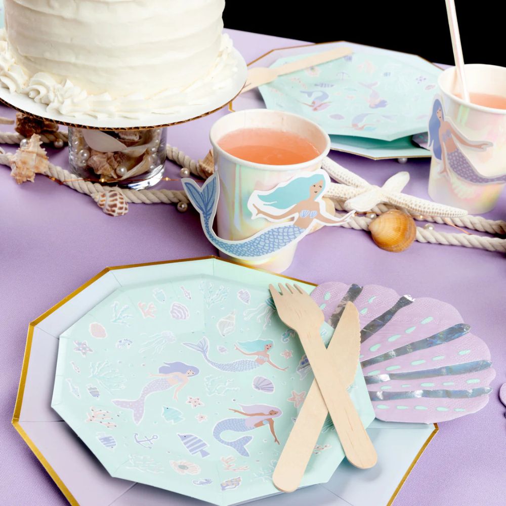 Seashell napkin with mermaid plates and party setup