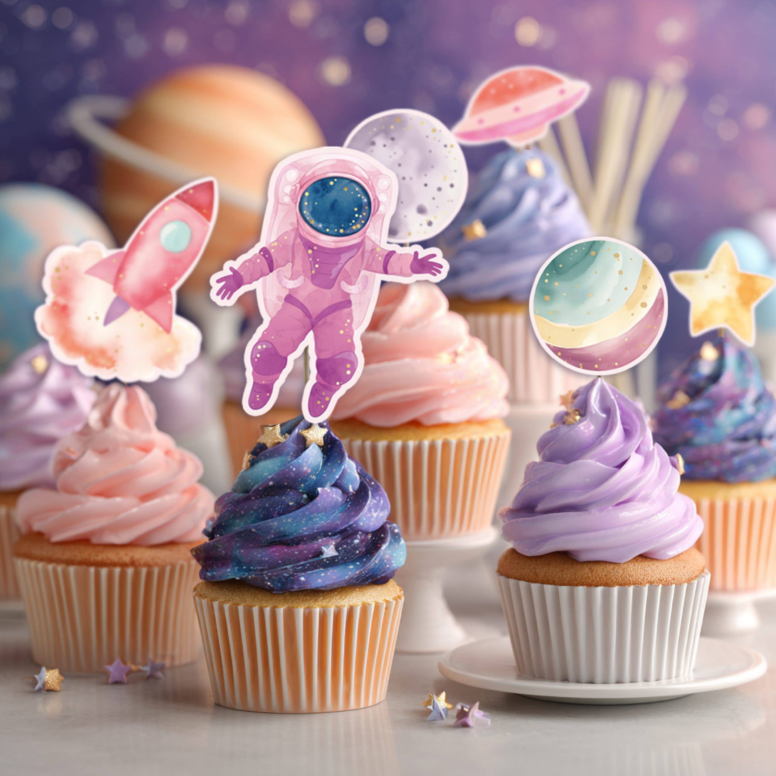 space themed cupcakes with astronaut and planet toppers on galaxy frosting