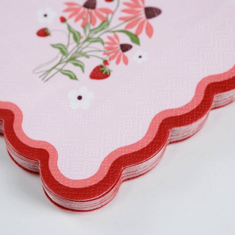 Tight macro shot of the 3-ply texture and red scalloped edge on the Strawberry Cocktail Napkins.