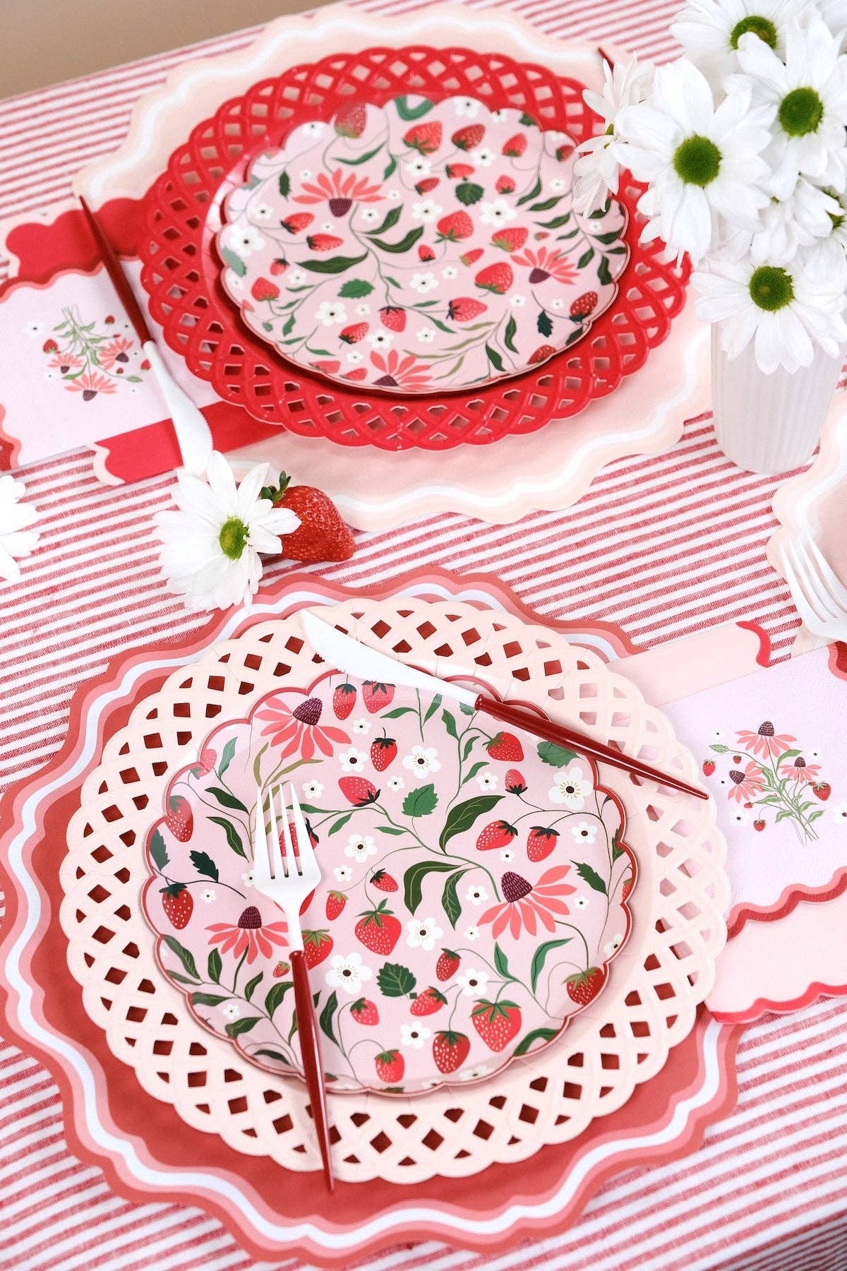 Two Strawberry Cocktail Napkins styled on a red striped runner for a Cottagecore Picnic.