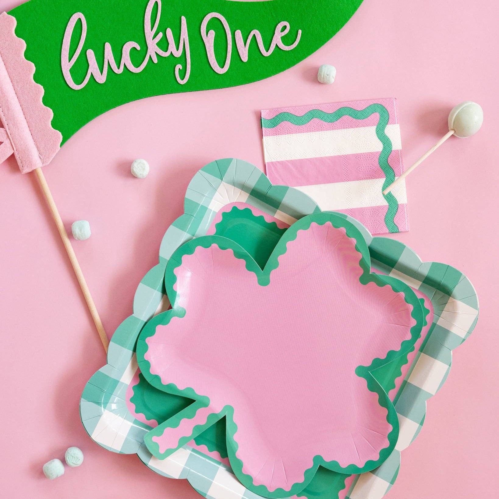 Close-up of striped cocktail napkins with green ric rac trim