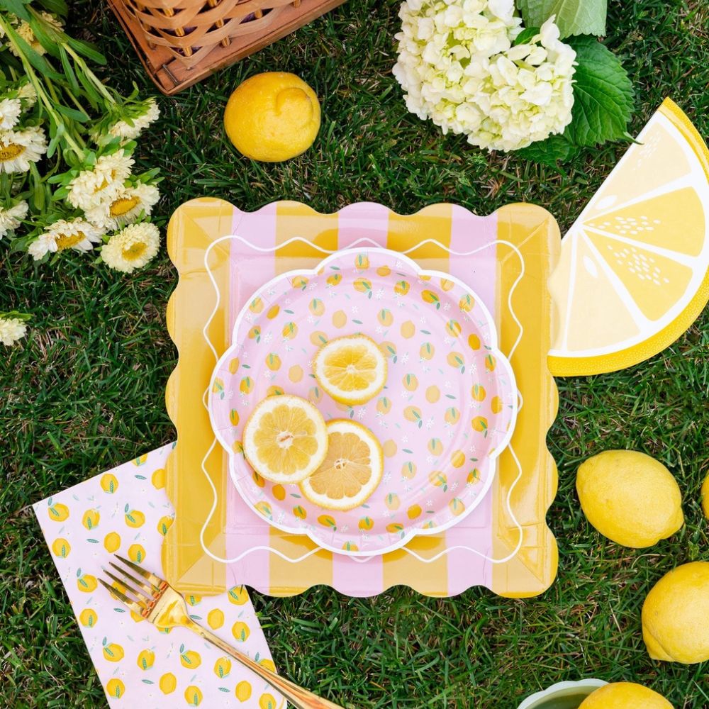Lemon themed setup with striped square plate and citrus decor