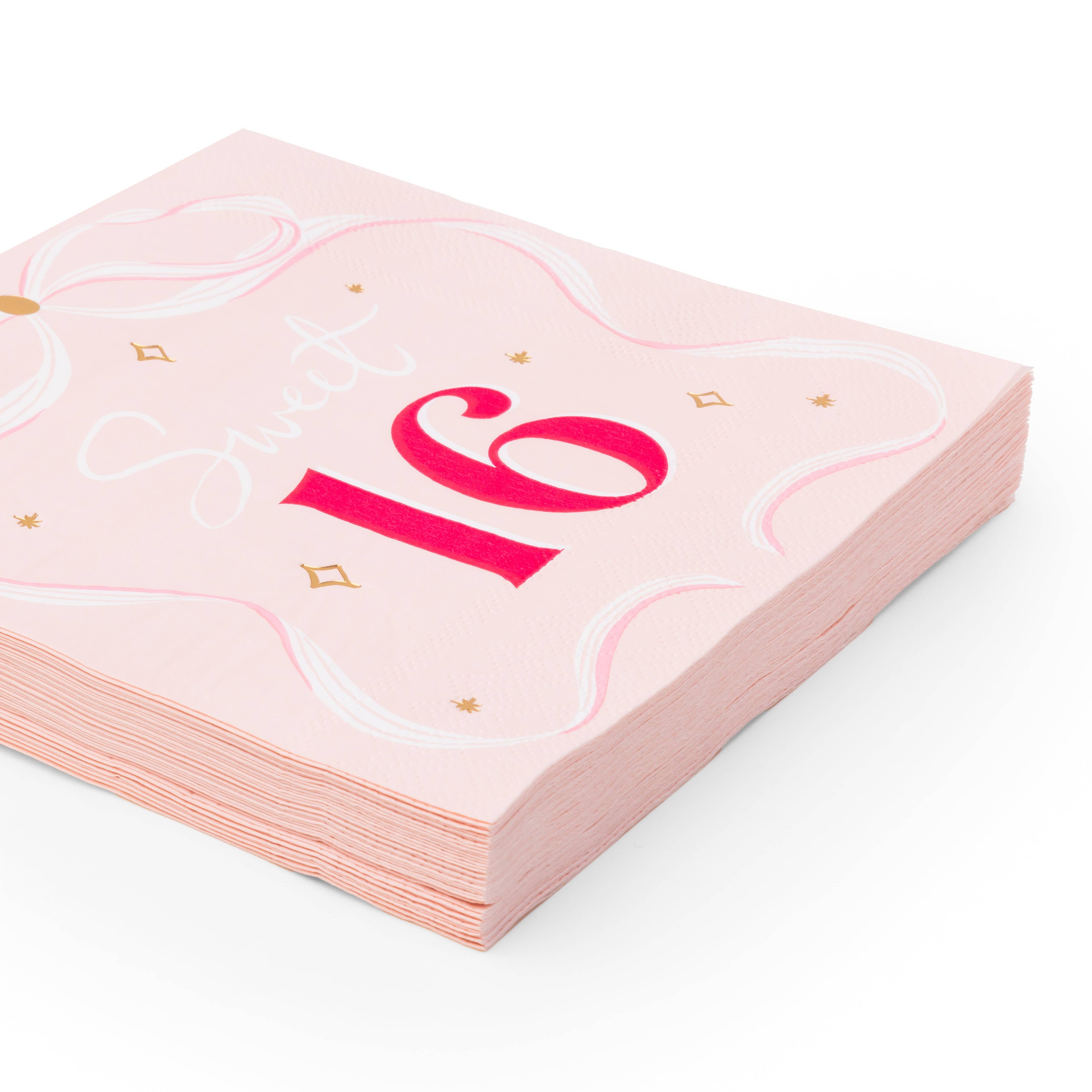 Stack of 3-ply petal pink napkins featuring a large red '16' and a hand-drawn white ribbon bow design.