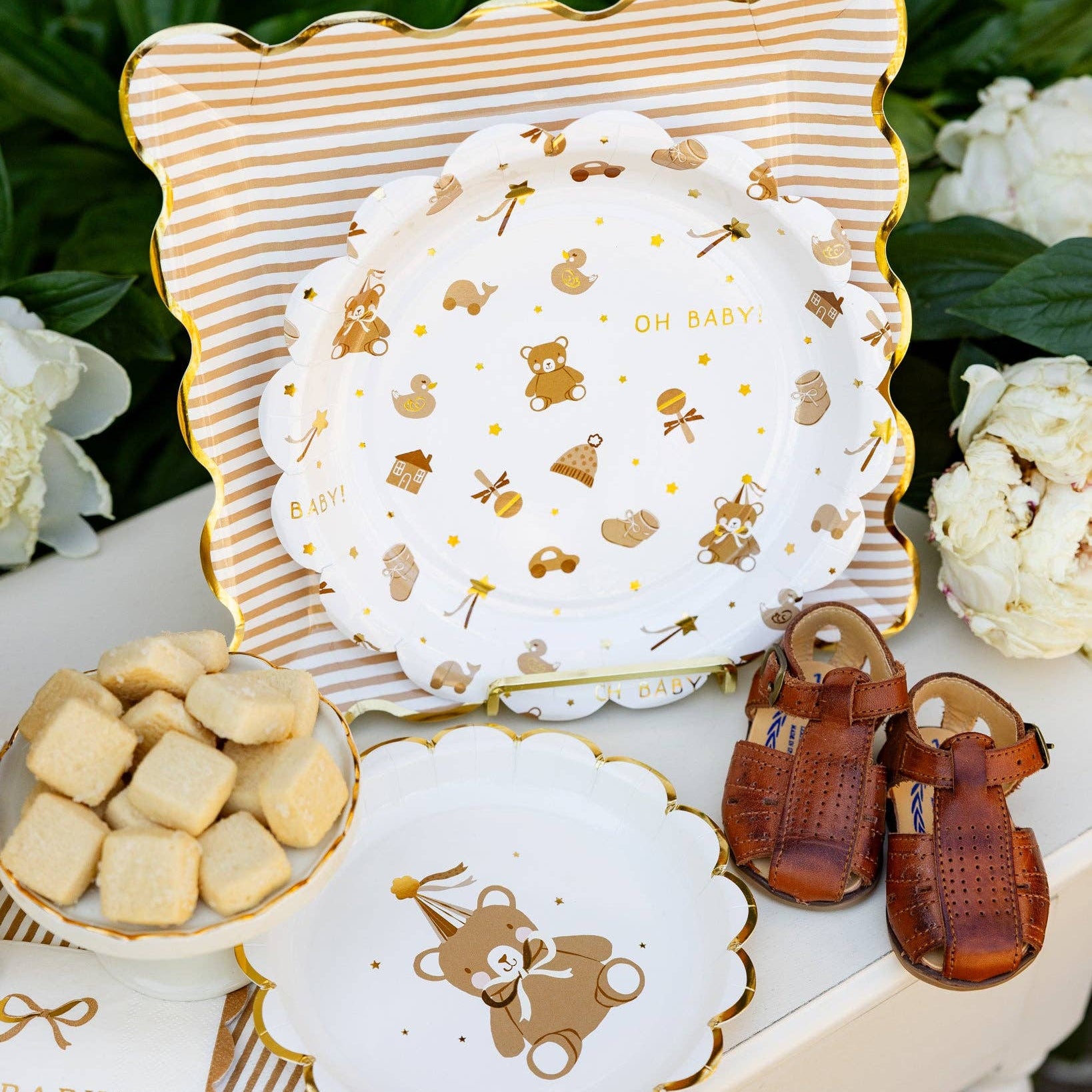 Teddy bear baby pattern plates styled on baby shower dessert table