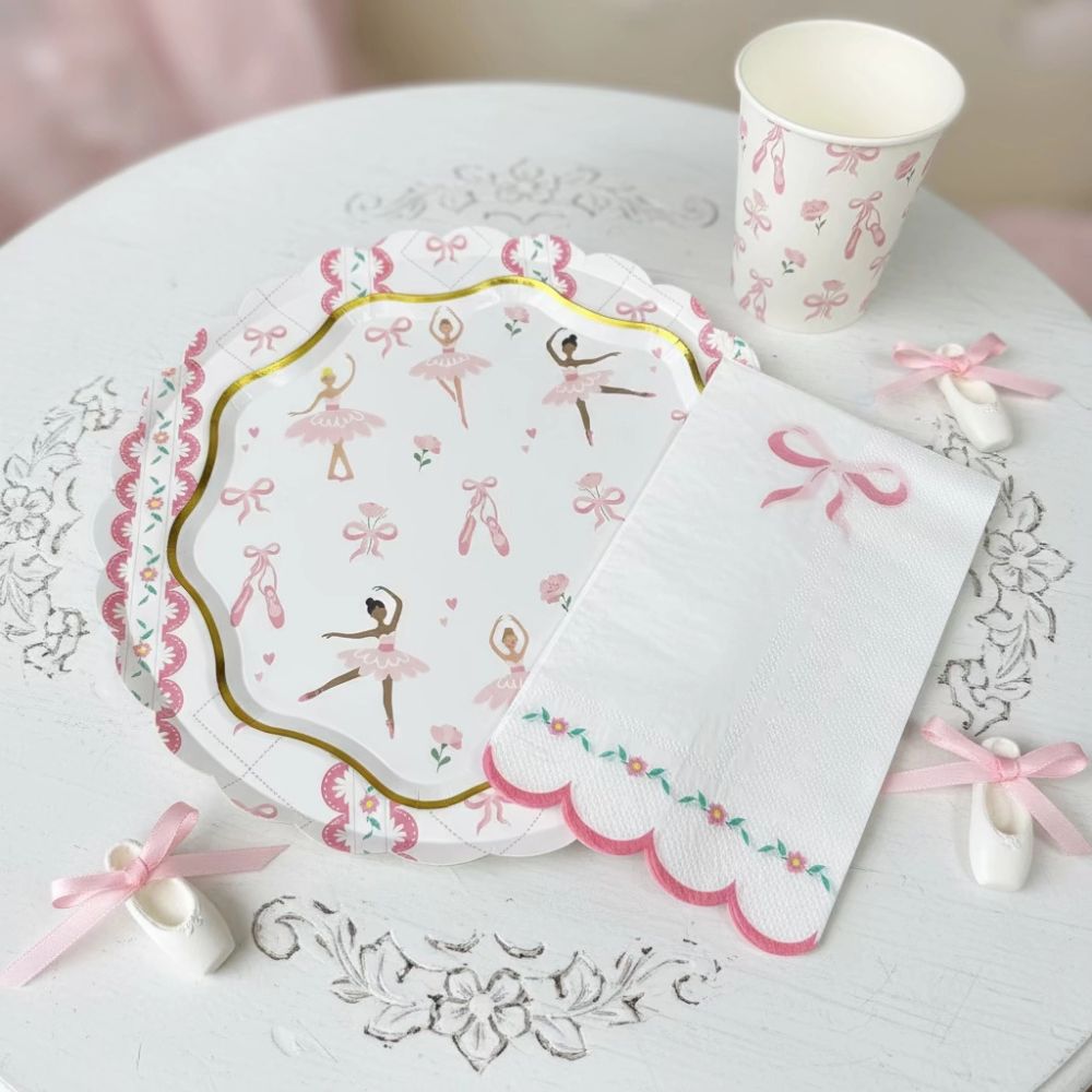 Pink ballerina plate stacked with a floral napkin