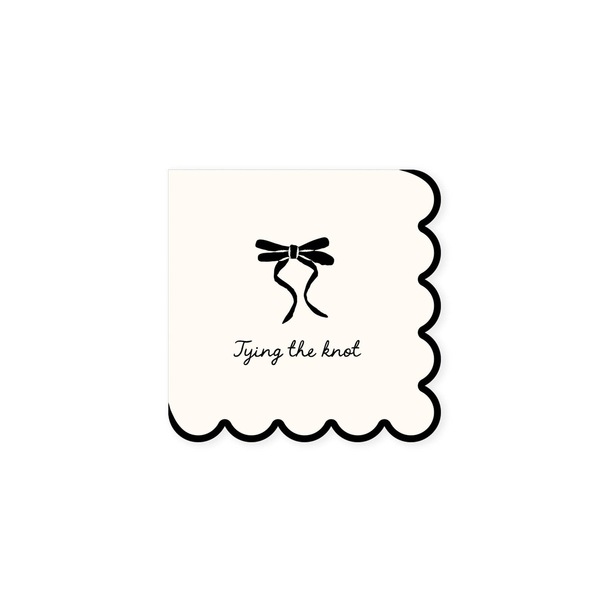 Tying the Knot cocktail napkin with black bow design and scalloped edge