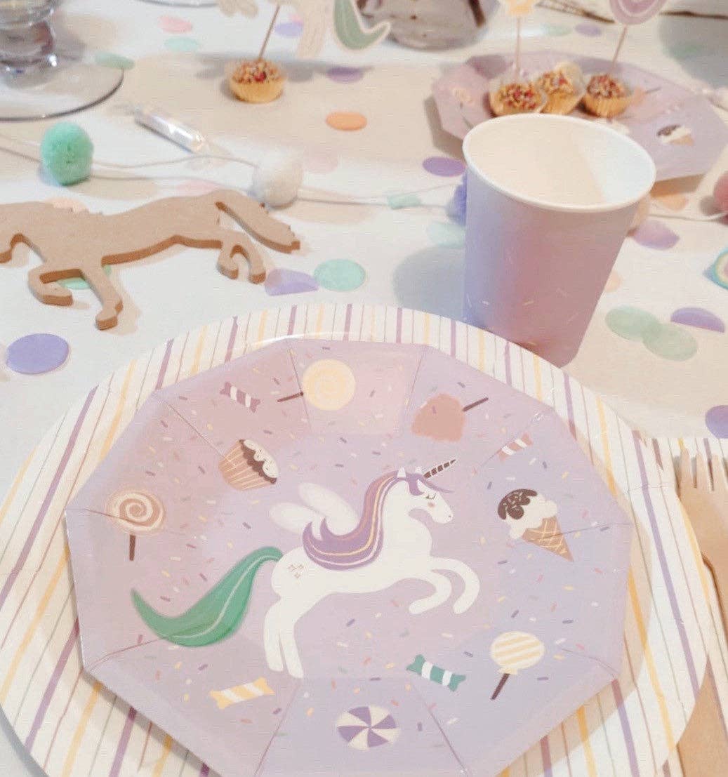 Pastel unicorn plate layered over a striped charger with matching cup