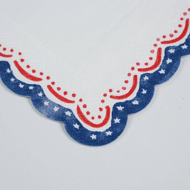 Macro detail of the hand-painted stars and blue scalloped edge on the Patriotic Cocktail Napkins.