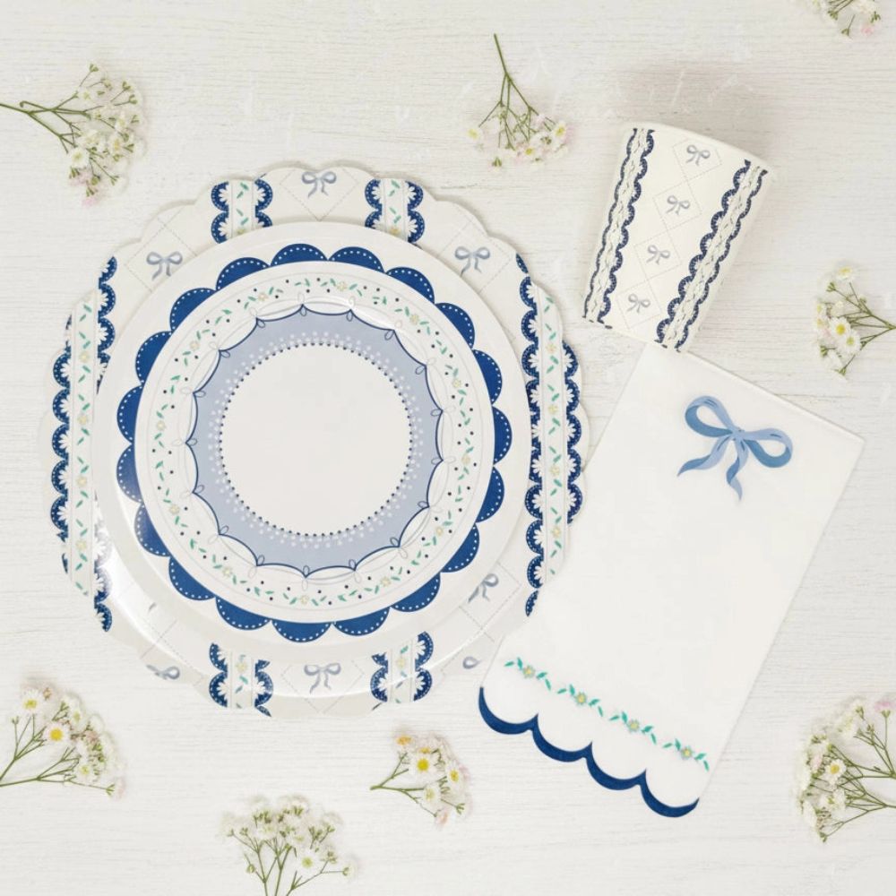 Overhead flat lay of blue ribbon tableware