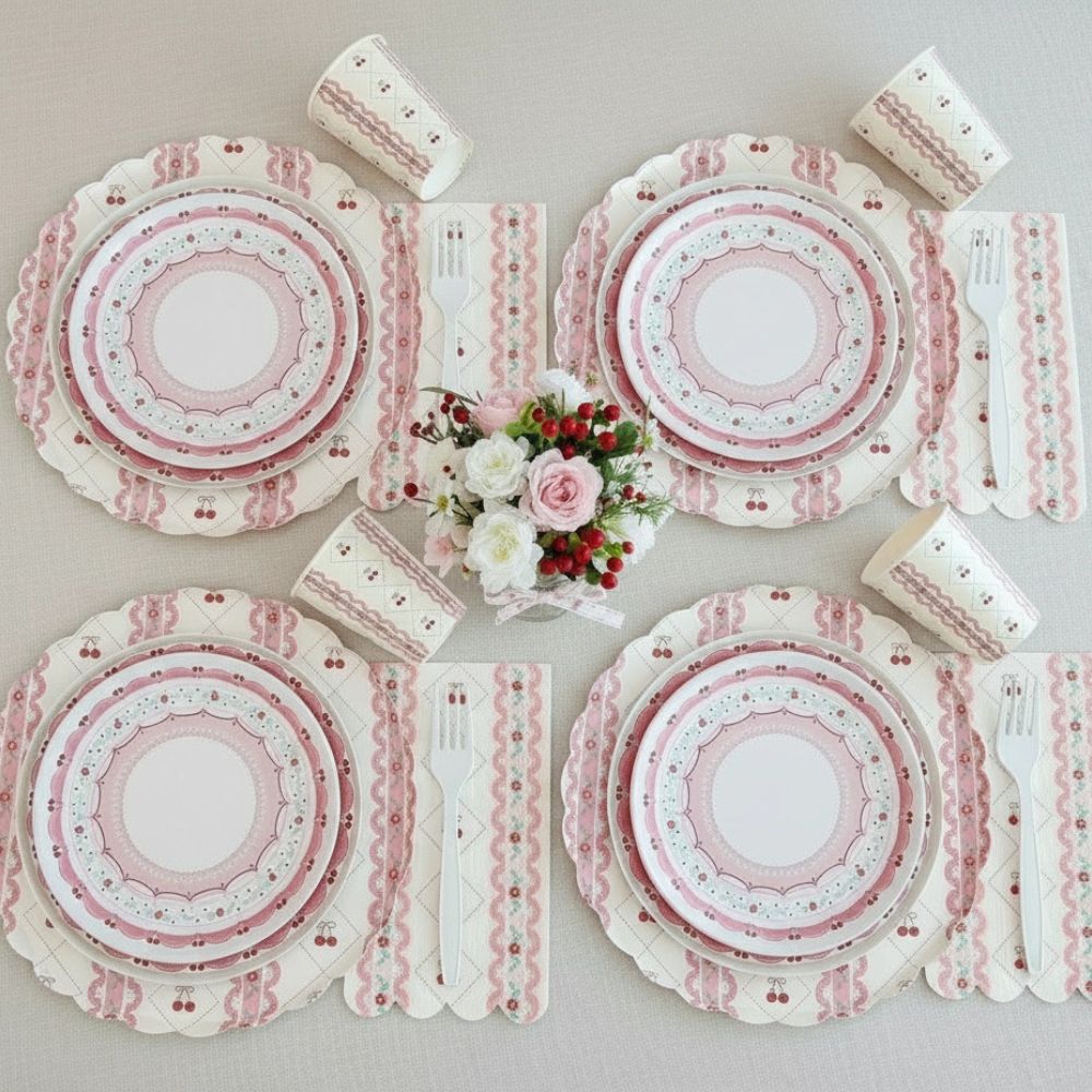 Symmetrical table arrangement with cherry tableware and white forks