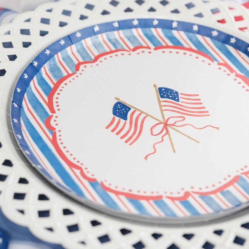 Close up of the watercolor flag design on the American Flag Paper Plates showing the scalloped edge.