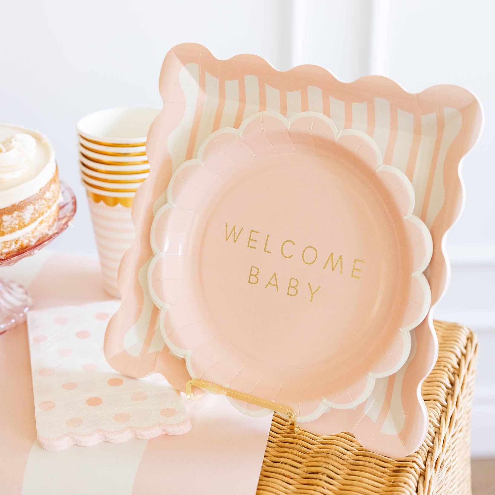 Welcome Baby pink plate styled on baby shower dessert table